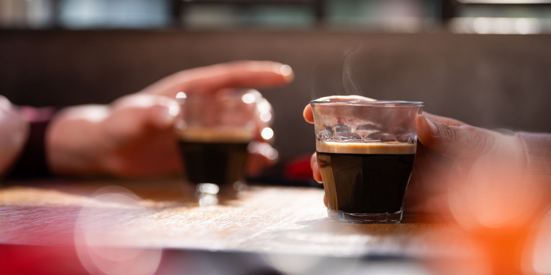 Two people holding coffee
