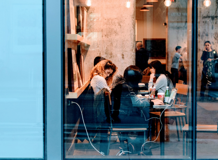 Girl at cafe drinking coffee